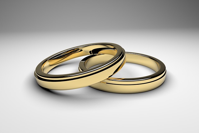 Two wedding rings on a neutral background